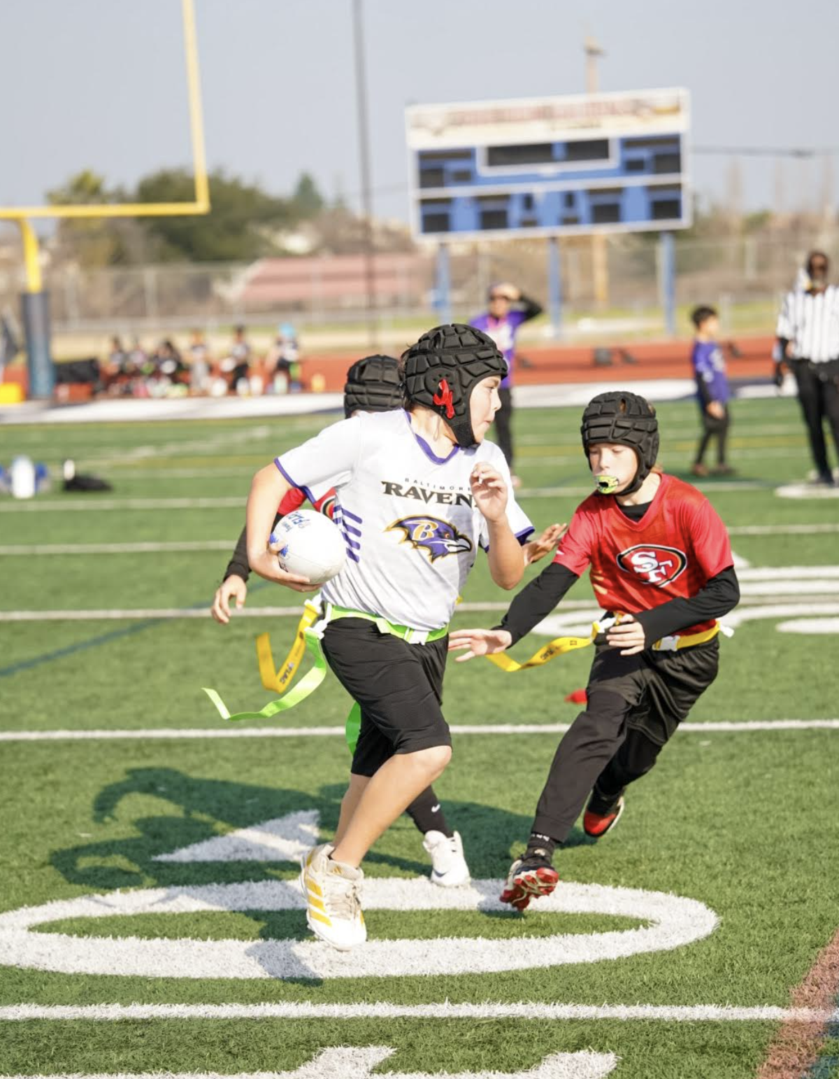 CFA flag football players competing on the field